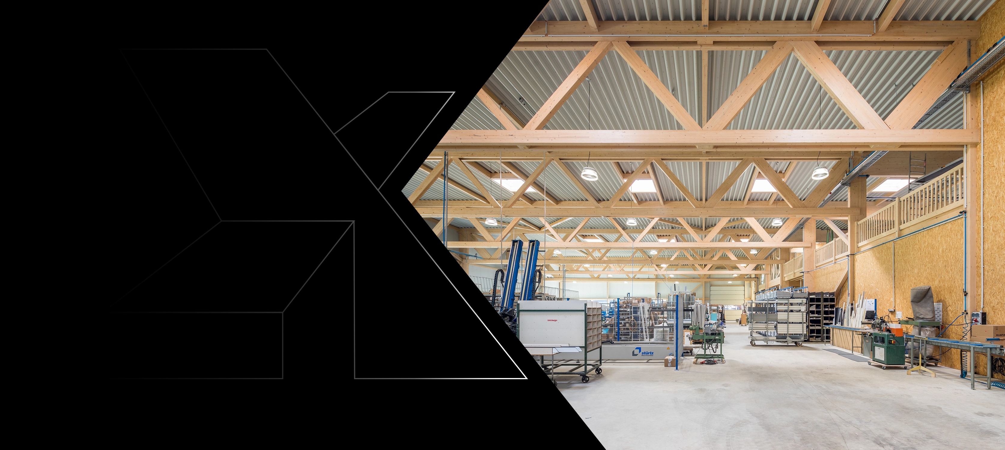 Timber industrial hall with truss girders above the production floor